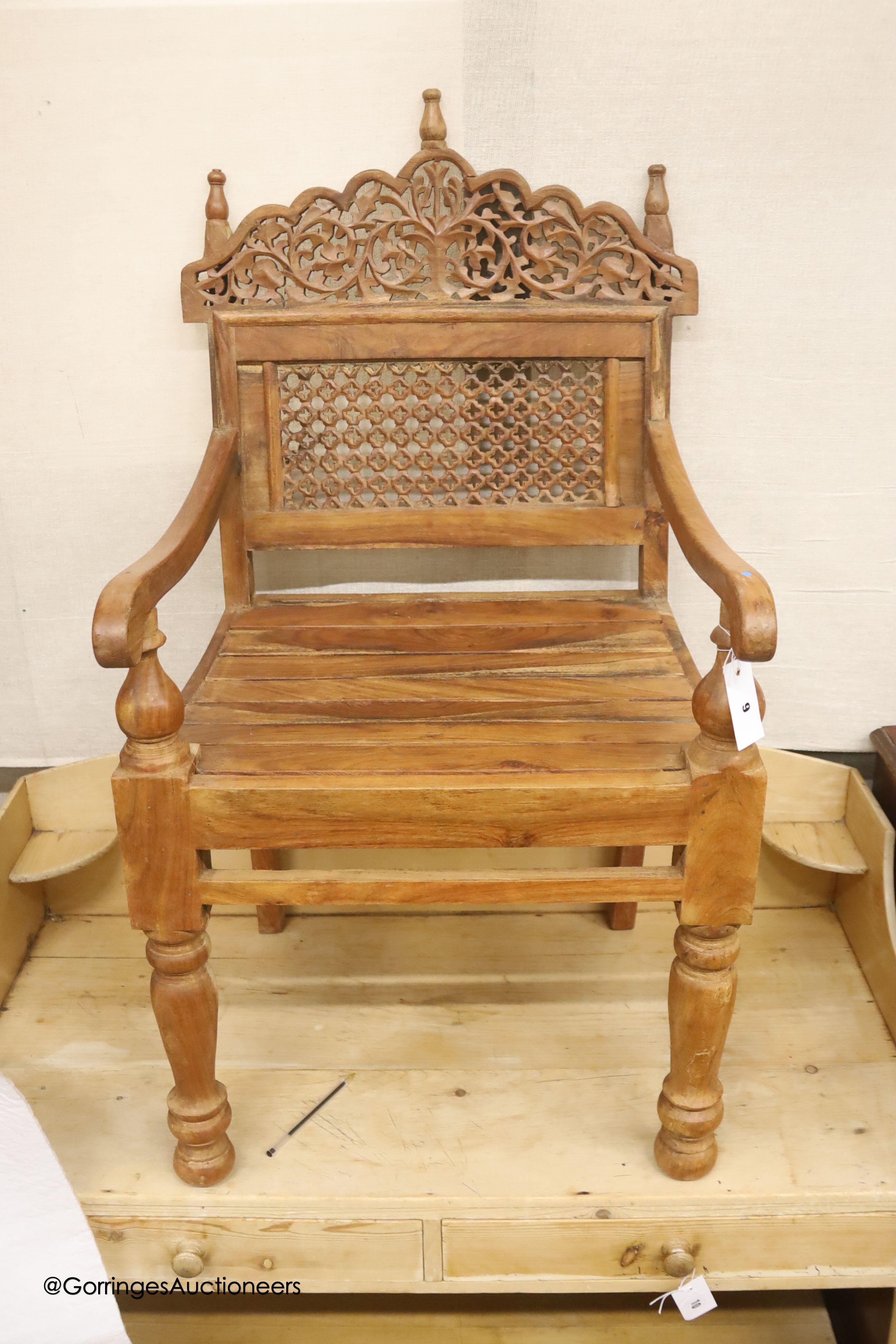 An Anglo-Indian carved hardwood elbow chair, width 55cm, depth 48cm, height 98cm